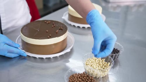 Decoration of the cake at confectionary factory.