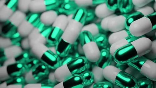 Green and White Capsules Close-Up