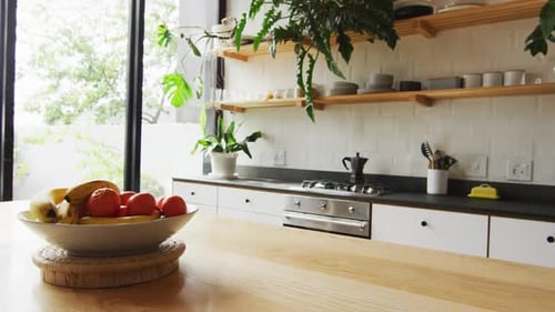 Bright Kitchen Interior with Fruit Bowl on Countertop