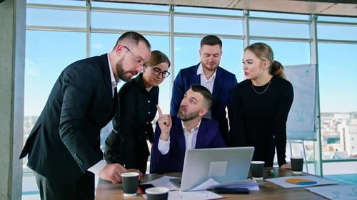 Business executives interacting with each other in conference room at office