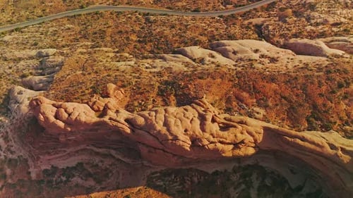 Amazing landscape of Arches National park in America. Highway going parallel to the beautiful canyon