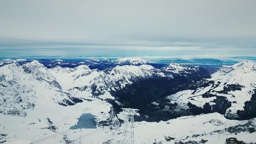 Picturesque panorama of mountains and valley village at Titlis, Engelberg