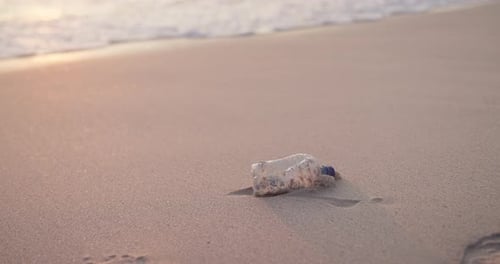 Beach, plastic bottle and pollution in environment for recycling volunteering