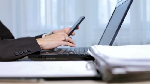 A civil engineer is working on a laptop. The calculation and planning of drawings.