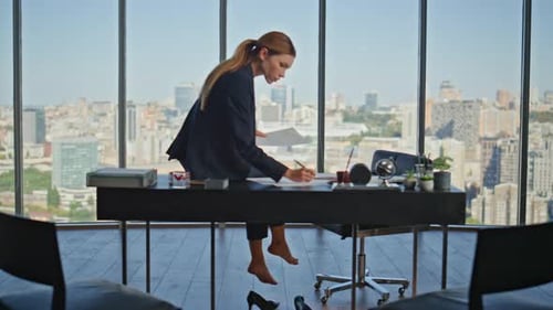 Office Woman Working Barefoot at Panoramic Window Focused Manager Study Paper
