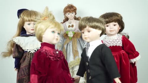Group of Antique Porcelain Dolls in Old-Fashioned Clothing