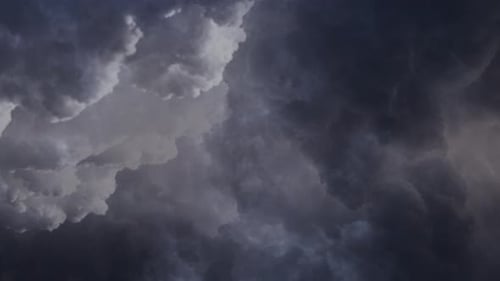lightning flashes among thick dark clouds.