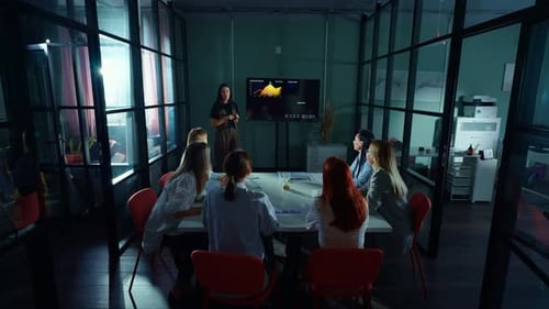 Dynamic Team Attends Engaging Presentation in Modern Office