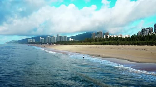 Aerial Top view of a transparent blue sea with beautiful waves at sunny day in summer. air of ocean