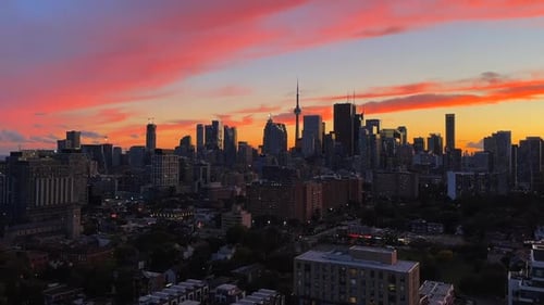 Toronto Skyline Vivid Sunset Sky Time lapse of City Scape with city lights and moving cars in backgr