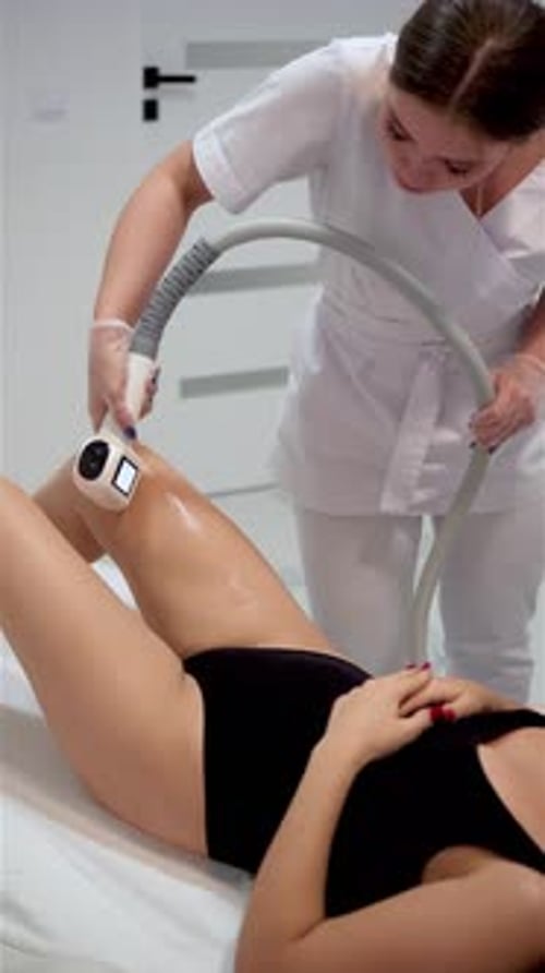 Laser Procedure in Beauty Studio or Clinic Body Care Hair Removal for Young Woman Vertical