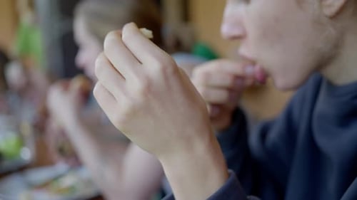 Group Eating Meal Together Indoors