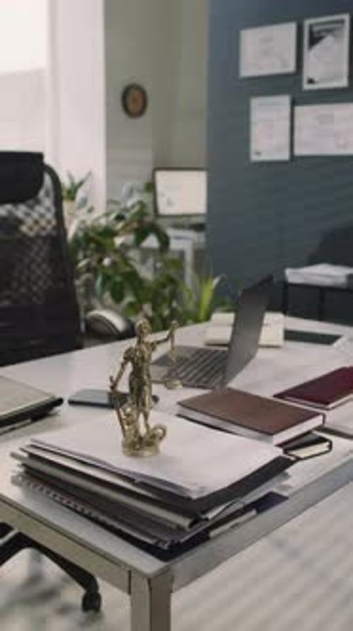 Vertical of Statue of Goddess Themis on Table in Law Office