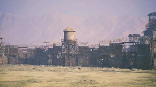 Old Water Tower Stands Among Collapsing Industrial Structures and Shadows