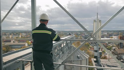 Construction Supervisor Overseeing Site A Construction Supervisor Inspects a Work Site From