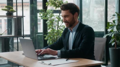 Successful Caucasian Businessman Manager Typing Laptop Writing Notes in Office Professional Male