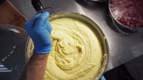 Chef Preparing Mashed Potatoes in a Commercial Kitchen