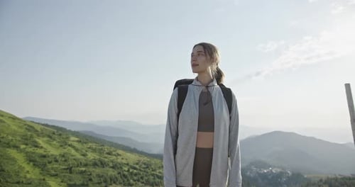Young Woman Hiking in Majestic Mountain Landscape