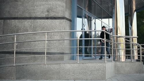 Young man running and jumping above obstacle in the city at daytime