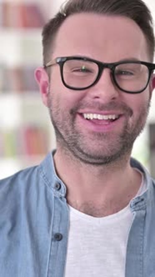Cheerful Man Smiling and Talking Directly to Camera