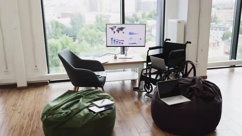 Modern Workspace with Wheelchairs Computers and City View for Accessibility