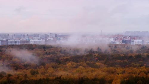 Panoramic view of the city in a foggy autumn day, time lapse