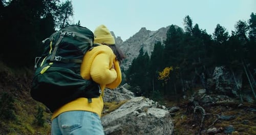 Backpacker Tourist on Autumn Vacation Hike on Mountain Solo Trip