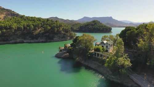 Aerial view of beautiful natural lakes with a old 1800's lake house overlooking the lake