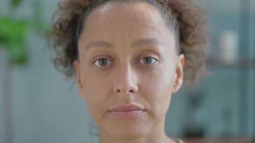 Close up of Serious Hispanic Woman at Home