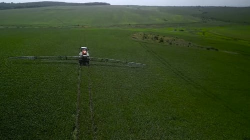 Spray Fertilize On Field With Chemicals In Agriculture Field