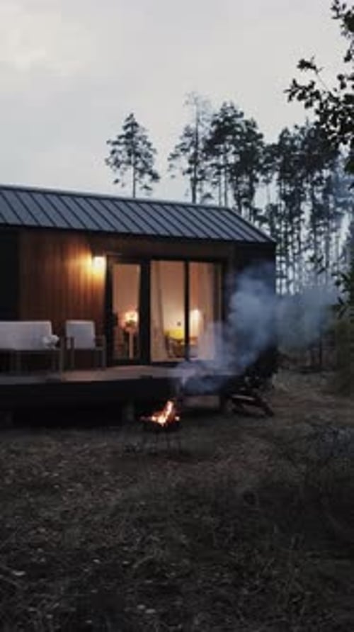 Cozy Cabin with Bonfire in Rural Forest Setting