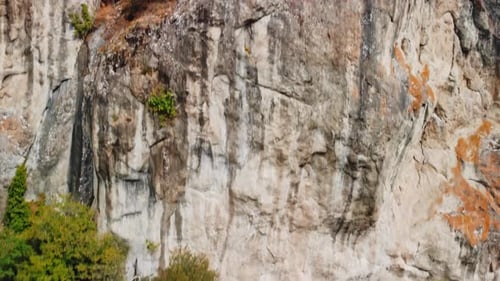 Closeup Aerial View of Majestic Rock Formations and Trees Growing Nearby Filmed in Georgia
