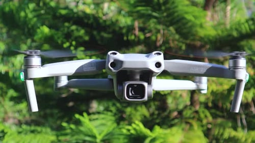 Quadcopter flying in the same place during a windy day with a detailed front part
