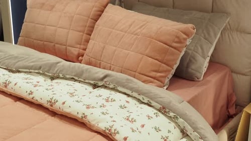 Inviting Bed with Pillows and Soft Bedding