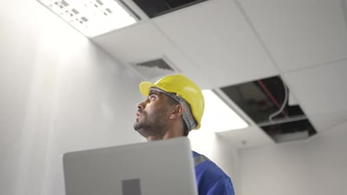 Engineer is working at tower.
