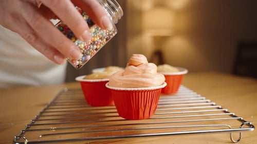 Decorating Delicious Cupcakes with Colorful Sprinkles