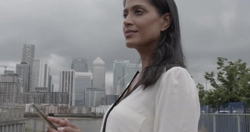 Businesswoman using Smart phone in City