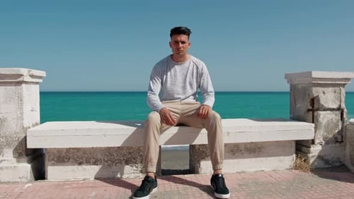 Man On The Beach Side Sit On A Beach