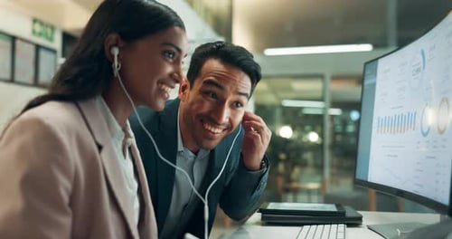 Happy, business people and night with earphones for music, audio or sound track at office