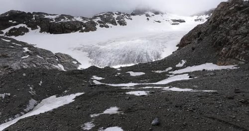 Raw beauty of Fellaria glacier in Italy in summer season. Aerial drone forward