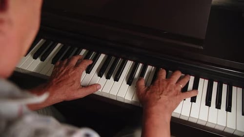 Hands Playing the Piano, Close Up