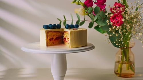 Cake with Blueberries and Flowers on Display