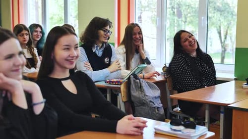 Students Attentively Listening to Teacher During Classroom Lesson at School