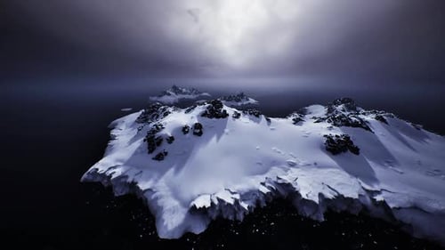 Serene Snowcovered Beaches Contrasting with Peaceful Sea Under Muted Light