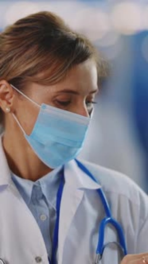 Woman Doctor with Face Mask and Stethoscope