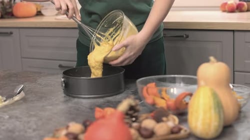 Putting Raw Dough Into Baking Form Cooking Pumpkin Cake for Thanksgiving Dinner