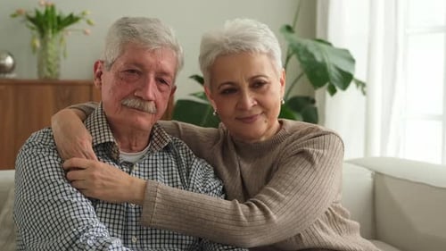 Loving Senior Couple Embracing at Home