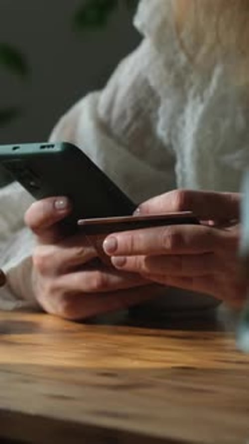 Vertical Video Person Making Payments on Ecommerce Sites with Bank Card