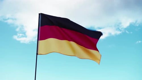 German Flag Fluttering Against a Sunny Blue Sky