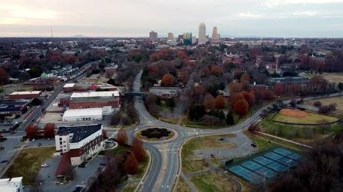 Winston Salem North Carolina skyline with traffic round about in shot